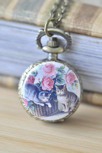 Bronze pocket watch necklace with two cats and pink roses illustration on the cover