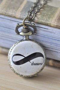 Antique bronze pocket watch necklace with infinity symbol and dream script design