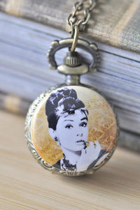 Bronze pocket watch necklace featuring a classic Hollywood portrait on a golden patterned background