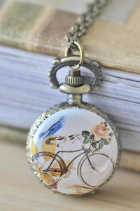 Bronze pocket watch necklace with bluebird and bicycle artwork pendant on chain