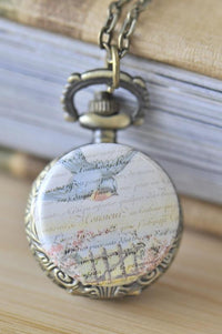 Vintage bird script pocket watch necklace with bluebird and French script design on bronze case
