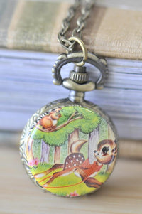 Brass pocket watch necklace with a vintage Bambi deer and squirrel woodland illustration