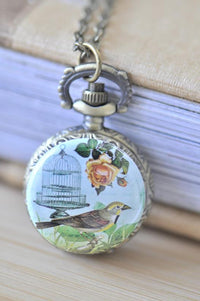 Antique brass pocket watch necklace with vintage bird, birdcage and rose artwork pendant