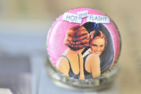 Detail shot of the retro pin up girl pocket watch pendant lid featuring vintage illustrated women