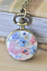 Watercolour flowers pocket watch necklace with pink and blue floral design and bronze-tone case