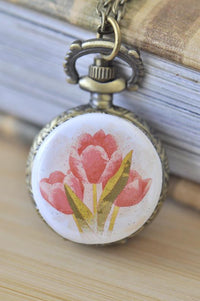 Antique bronze pocket watch necklace with a watercolour pink tulip design on the front cover