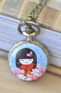 Kokeshi doll pocket watch necklace pendant with butterfly and pink blossoms on antique bronze case