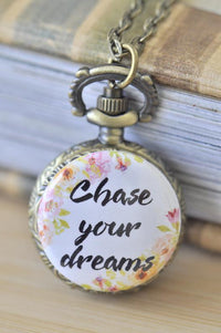 Antique bronze pocket watch necklace with a floral Chase Your Dreams quote cover