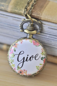 Antique brass pocket watch necklace with "Give" script and watercolour floral design