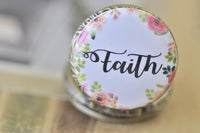 Close-up of Faith pocket watch pendant with pink and green floral wreath design