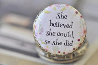 Close-up of pocket watch lid with floral border and inspirational quote design