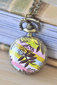 Brass pocket watch necklace with pastel striped floral artwork pendant on chain