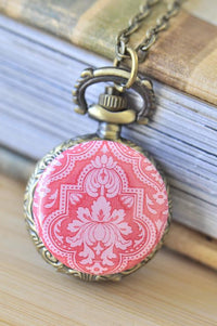 Pink damask pocket watch necklace with antique brass engraved case detail