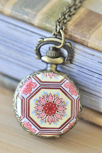 Bronze pocket watch necklace with pink and red lotus flower pattern in geometric octagonal frame