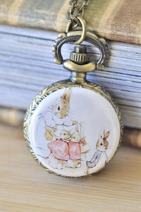 Peter Rabbit pocket watch necklace pendant with bunny family illustration on the front cover