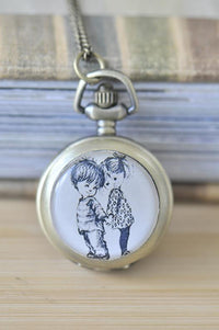 Antique brass pocket watch necklace with sketched boy and girl design pendant