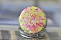 Close up of the yellow dahlia floral pocket watch pendant face