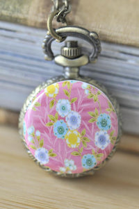 Cherry blossom pocket watch necklace with pink floral design in antique bronze case