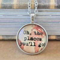 Round silver pendant necklace with map background and text reading Oh the places you'll go