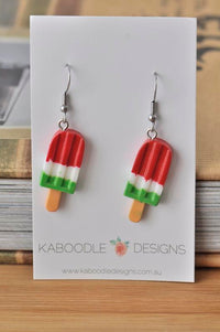 Pair of watermelon ice pop resin earrings on a Kaboodle Designs card, red white and green stripes with wooden stick