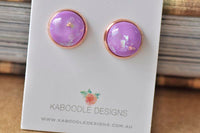 Round purple resin stud earrings with gold foil flecks in rose gold setting, on Kaboodle Designs card