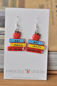 Resin apple and stacked textbook drop earrings reading Art, Math, Reading, on Kaboodle Designs card