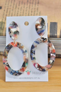 Multicolour tortoiseshell resin oval dangle earrings on Kaboodle Designs card