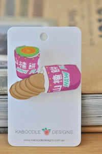Pink Haw Flakes packet brooch with rainbow swirl lid and spilling biscuits, pinned to card