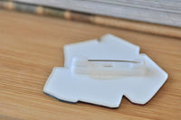 Back view of the brooch showing the hinge clasp pin fastening