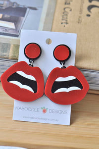 Red perspex lips drop earrings with round stud tops on Kaboodle Designs card