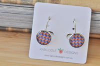 Round chevron pattern dangle earrings in coral and blue on Kaboodle Designs card