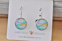 Round dangle earrings on Kaboodle Designs card showing abstract aqua, lilac and yellow artwork with polka dots