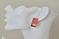 Single Shin Ramyun packet stud earring shown worn on an ear