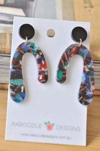 Tortoiseshell acrylic horseshoe drop earrings on Kaboodle Designs card, front view