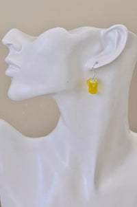 Single beer jug resin earring worn on ear, shown close up on mannequin