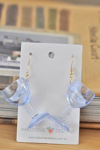 Clear plastic wine glass earrings on Kaboodle Designs display card with gold hooks