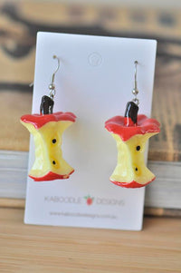 Pair of acrylic apple core drop earrings on Kaboodle Designs display card