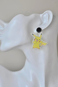 Single cartoon mouse acrylic earring shown on model ear for scale