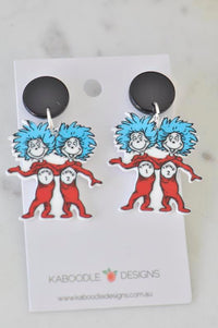 Acrylic Thing 1 and Thing 2 drop earrings with black stud tops on backing card