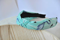 Mint chiffon headband with blue flamingo print and central knot, side angle
