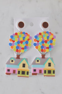 Perspex balloon house drop earrings on card, showing rainbow balloons and pastel house design