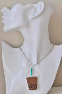 Boba milk tea necklace shown on display bust with silver chain
