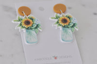 Front view of two sunflower bouquet drop earrings showing jar and floral detail