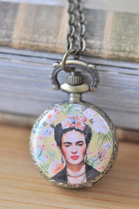 Antique bronze pocket watch necklace featuring a floral Frida Kahlo portrait on a chain