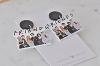 Pair of Friends dangle earrings laid flat on branded Kaboodle Designs card