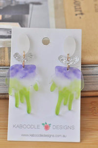 Acrylic brush drop earrings in purple and green on Kaboodle Designs card