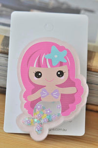 Acrylic mermaid brooch with pink hair, starfish clip and glitter-filled tail, front view