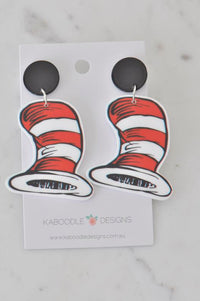 Pair of red and white striped hat drop earrings with black stud tops on card