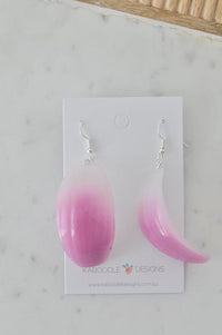 Pink ombre resin onion slice earrings on Kaboodle Designs card, front view