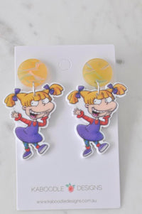 Acrylic Angelica Rugrats earrings with marbled yellow stud top on Kaboodle Designs card